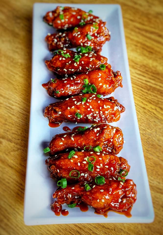 a white plate with Gochujang Wings