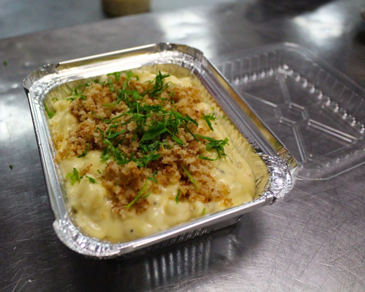 a to go container of mac & cheese