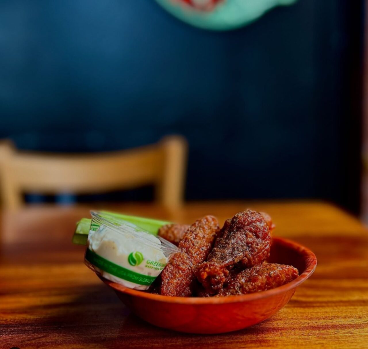A bowl of wings on a table